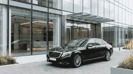 Premium sedan parked in front of office building